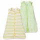 Two Nintara Baby sleep bags, Citrus Stripes in lime green and yellow horizontal stripes, and Forest Flutter in lime green dot and dash print, both with front zippers and tulip appliqués.