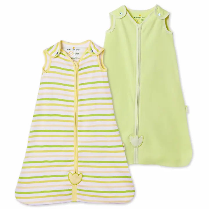 Two Nintara Baby sleep bags, size M. Citrus Stripes in lime green and yellow horizontal stripes, and Soft Sage in solid sage green, both with front zippers and tulip appliqués at zipper base.