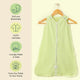 Nintara Baby sleep sack on a wooden hanger. Features icons highlighting soft and breathable fabric, GOTS certified organic cotton, lovingly made in India, and sourced from field to home.