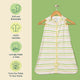 Nintara Baby sleep sack on a wooden hanger. Features icons highlighting soft and breathable fabric, GOTS certified organic cotton, lovingly made in India, and sourced from field to home.