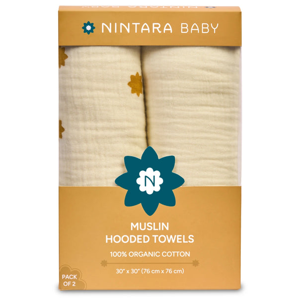 Pack of two organic cotton muslin hooded towels in warm white and butterscotch stars