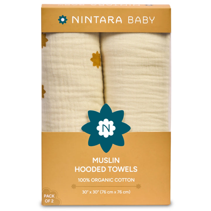 Pack of two organic cotton muslin hooded towels in warm white and butterscotch stars