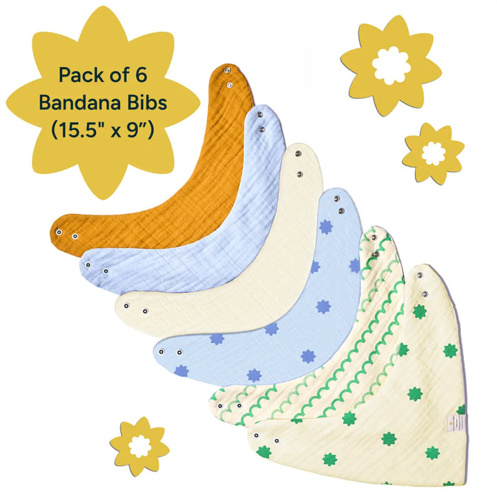 A vibrant, clean display of six soft, muslin cotton bandana bibs arranged in a fan shape. The bibs come in a mix of pastel colors, including mustard yellow, light blue, and pale white, each decorated with subtle patterns like stars, abstract lines, and green dots. Each bib features snap fasteners for easy adjustment and a perfect fit, ideal for babies with sensitive skin. The size of each bib is 15.5" x 9". A soft yellow flower graphic indicates the pack of six