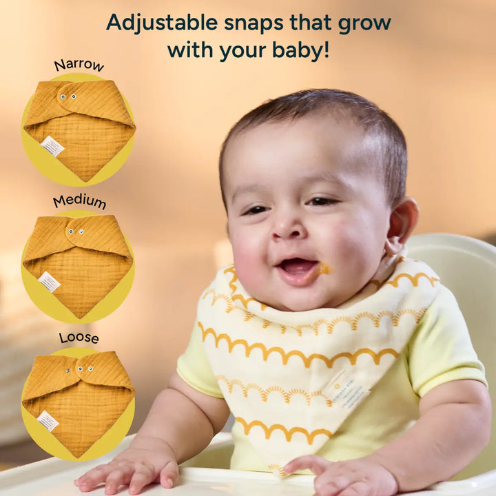 A clean studio-style image displays a stack of six baby bandana bibs in soft pastel and mustard tones. Arranged in a neat fan shape, the bibs showcase a mix of solid colors-”mustard yellow, pale blue-”and gentle patterns including stars and abstract lines, all printed on breathable muslin cotton. Each bandana bib is triangular with rounded edges and features a tiny snap fastener near the upper corners for easy adjustability.