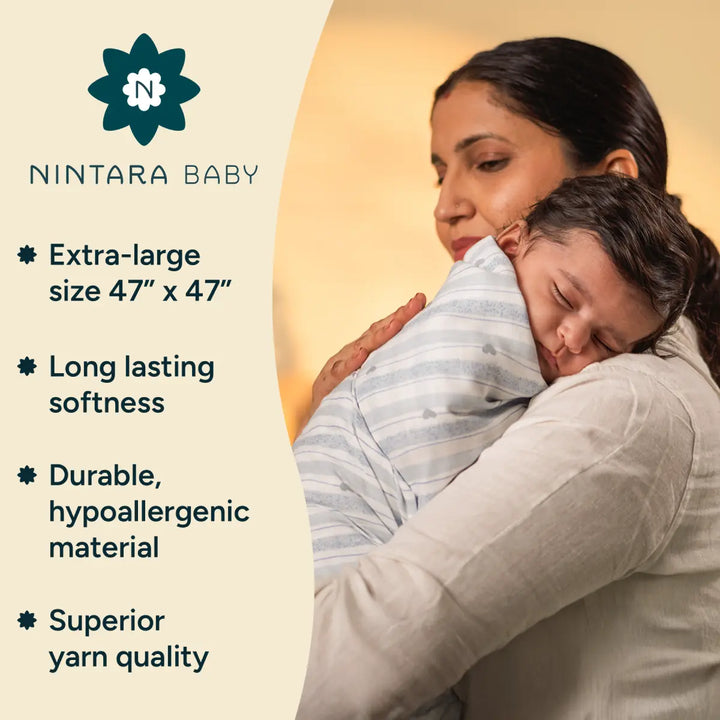 A tender image of a mother holding her baby, wrapped in a soft yellow Nintara Baby swaddle. The baby looks relaxed and comfortable in the swaddle, which is made from durable, hypoallergenic material that’s gentle on their sensitive skin. The extra-large size ensures the baby stays snug, and the long-lasting softness of the swaddle is emphasized, showing that it won’t lose its quality after multiple washes.
