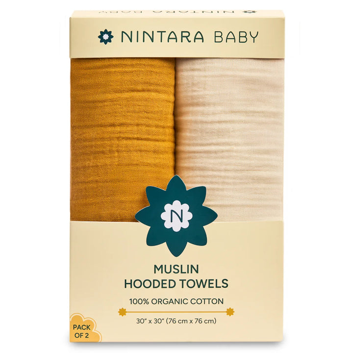 Two yarn rolls in golden yellow and cream labeled NINTARA BABY for Baby Hooded Towel Set