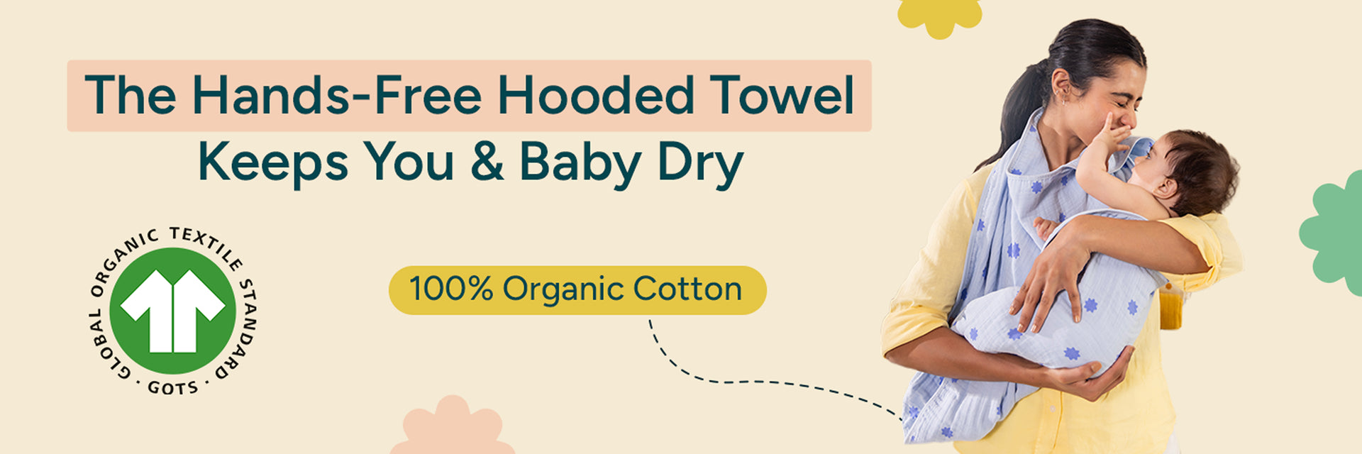 Banner Showing a Mother holding a baby wrapped in a blue hooded towel, highlighting a hands-free hooded towel made from 100% organic cotton that keeps both parent and baby dry.